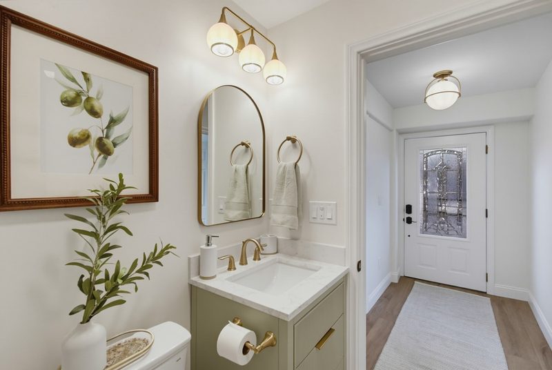 View from the hall into the finished guest bath, by KDC Interiors