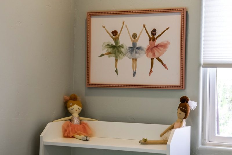 Ballerina artwork displayed with dolls, by KDC Interiors