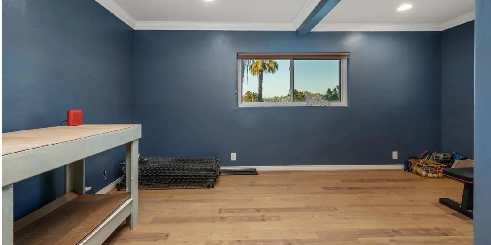 Before: the navy pottery studio with a workbench along the wall
