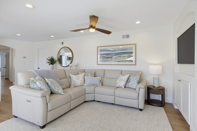 Leather sectional facing the new built-in TV niche, by KDC Interiors